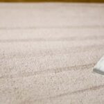 This is a photo of a carpet steam cleaner cleaning a cream carpet works carried out by Chessington Carpet Cleaning