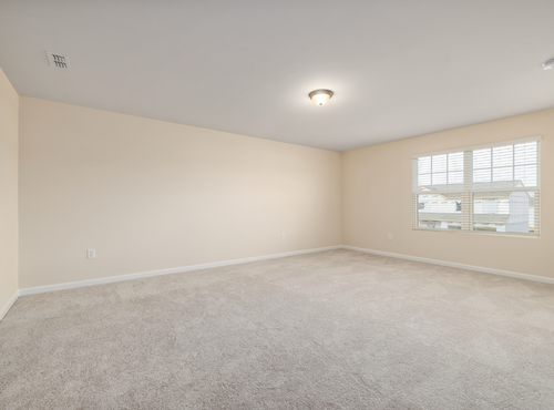 This is a photo of an empty room with cream carpets works carried out by Chessington Carpet Cleaning